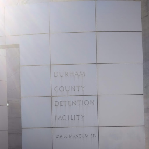 Blocked exterior of outside of a building with Durham County Detention Facility in capital letters